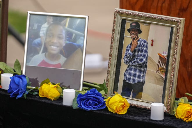 Photos of Malachi Williams are placed on a table at a vigil outside San Marcos City Hall on Thursday, April 25, 2024 in San Marcos, Texas. Williams was killed by San Marcos Police on Thursday, April 11, 2024.