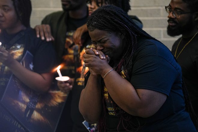 Shanta Miller cries while watching home videos of her son Malachi Williams at a vigil outside the San Marcos Public Library on Thursday, April 25, 2024 in San Marcos, Texas. Williams was killed by San Marcos Police on Thursday, April 11, 2024.